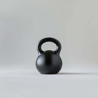 Kettlebell for fitness and equipment, durable cast iron design with a sturdy handle for strength training.