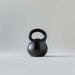 Kettlebell for fitness and equipment, durable cast iron design with a sturdy handle for strength training.